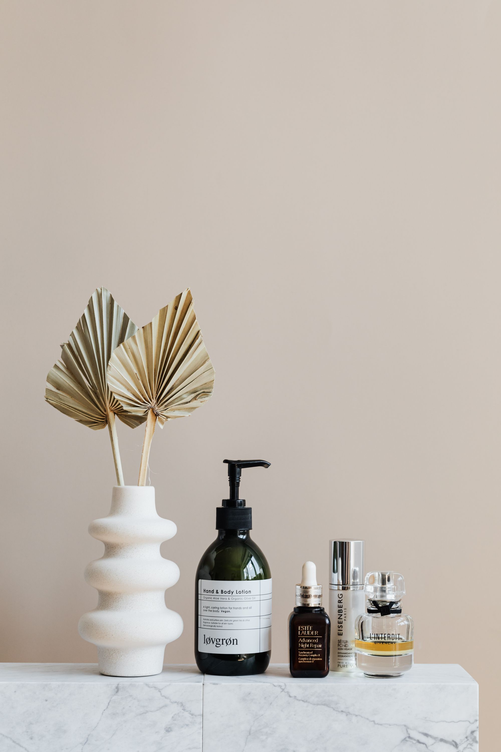 Skincare products on a marble shelf